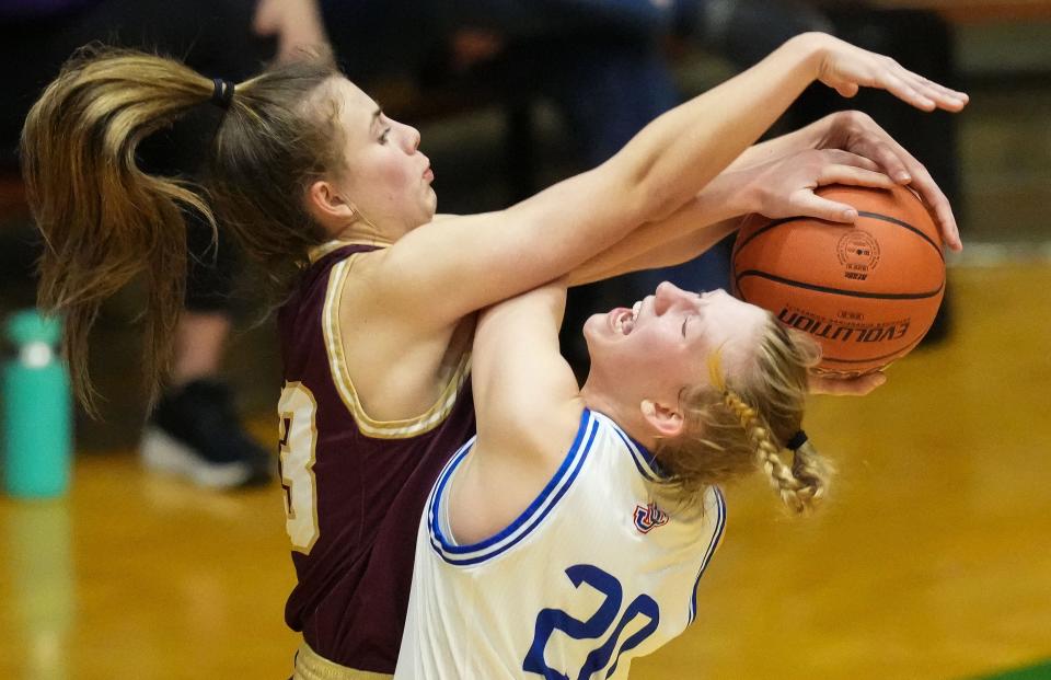 Columbia City Eagles Addison Baxter (33) stops Jennings County Panthers Alivia Elmore (20) from scoring Thursday, Oct. 5, 2023, during the Hall of Fame Classic girls basketball tournament at New Castle Fieldhouse in New Castle. The Columbia City Eagles defeated the Jennings County Panthers, 56-47.