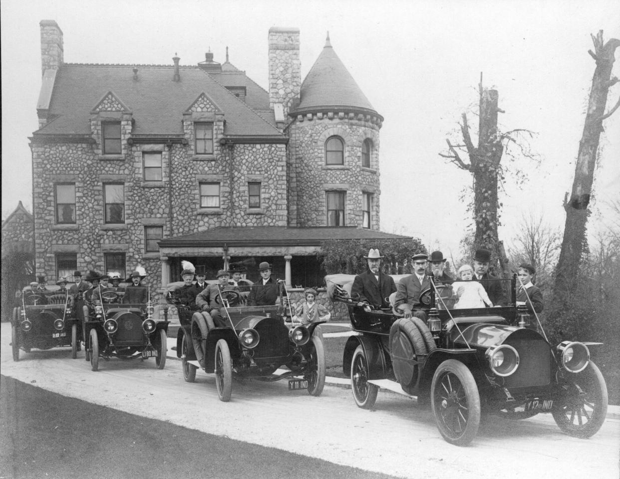 The south side of Tippecanoe Place, the grand South Bend home Clement Studebaker had built in 1889, is visible in this 1908 photo. In the foreground are four automobiles with some of the Studebaker clan, including J.M. Studebaker seated in the right rear of the front car.