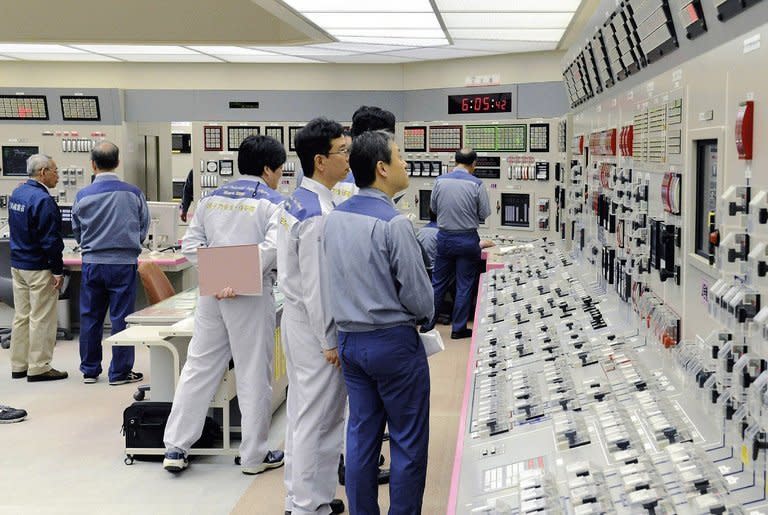 Kansai Electric Power engineers check readings at the Oi nuclear plant in Japan on July 19, 2012. Workers began switching off one of Japan's two working reactors Monday, with the other set for shutdown later this month and no restarts in sight. Kansai Electric Power started reducing generating power at its Unit No. 3 at the Oi plant in the western prefecture of Fukui, a company spokesman said