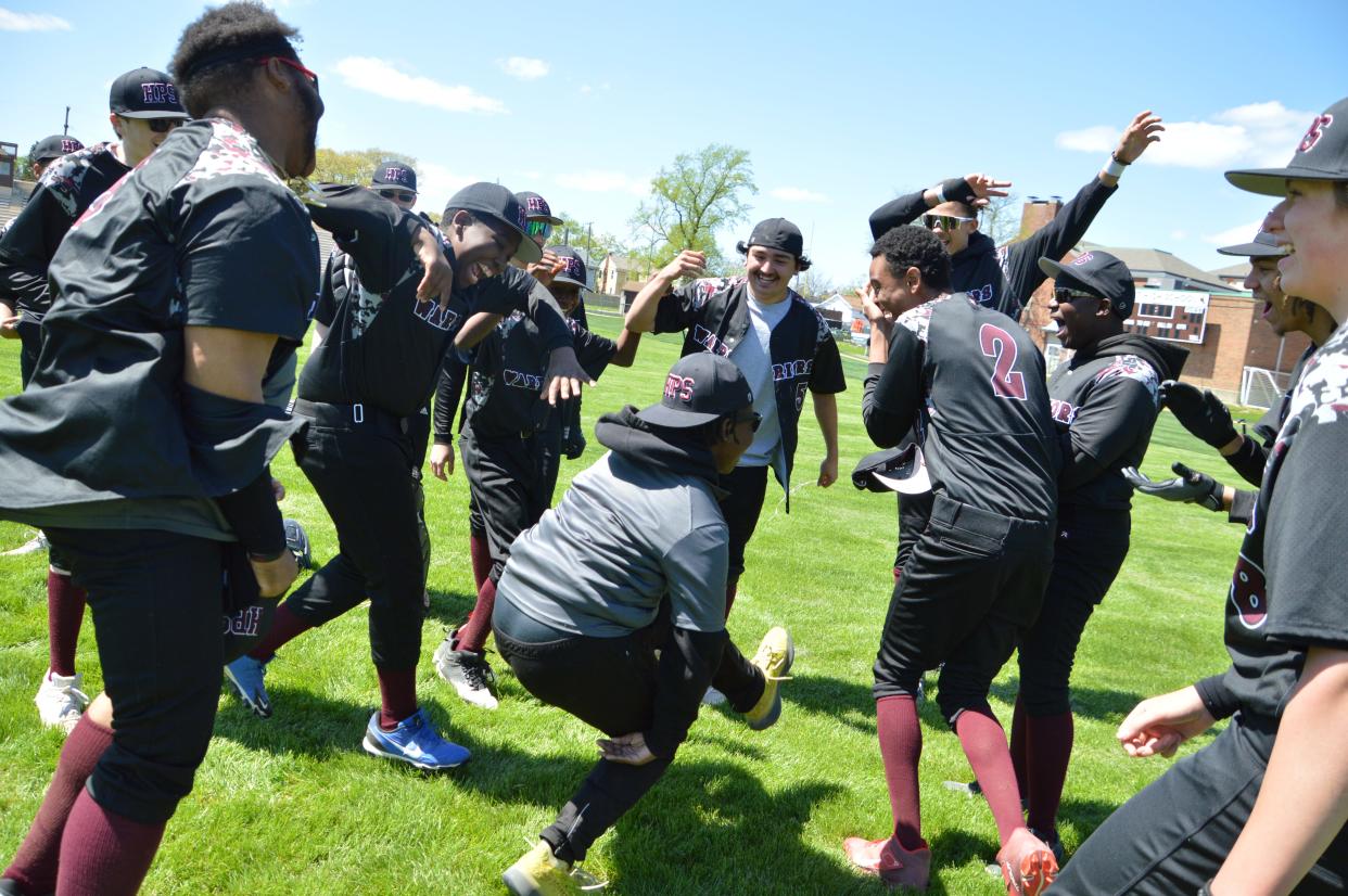 Members of the Harvest Prep baseball team celebrate a 7-3 victory over West on Saturday. It was the Warriors' first win since April 2015.