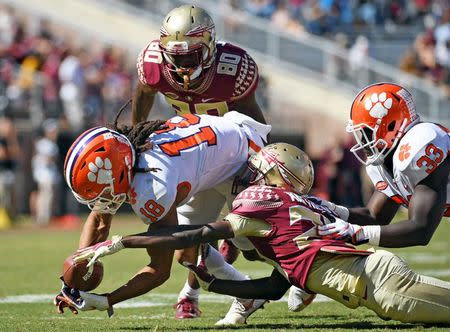 Oct 27, 2018; Tallahassee, FL, USA; Clemson Tigers wide receiver TJ Chase (18) recovers a fumble on a punt by Florida State Seminoles wide receiver DJ Matthews (29) during the second half at Doak Campbell Stadium. Mandatory Credit: Melina Myers-USA TODAY Sports