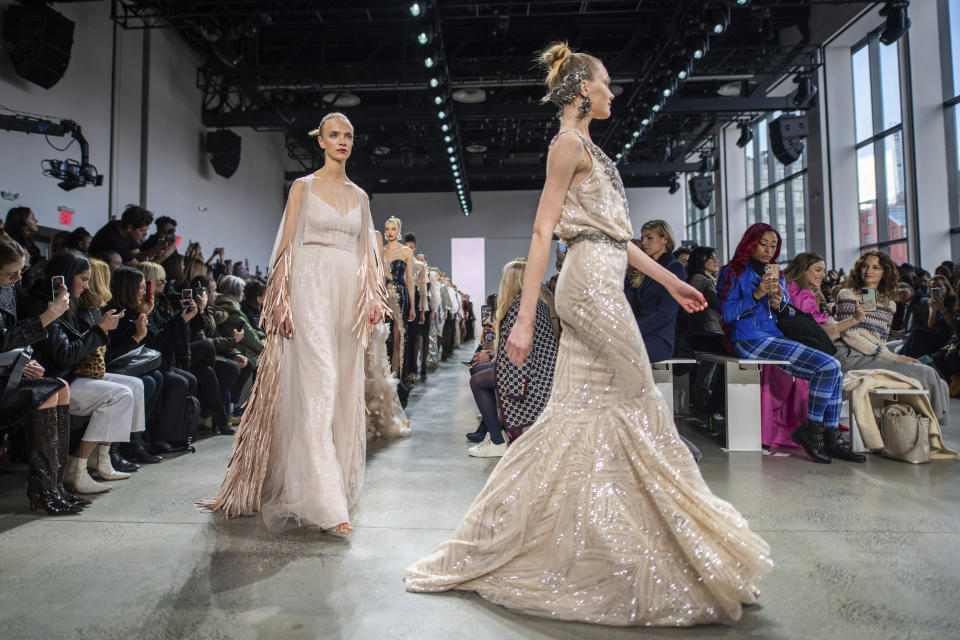 The Badgley Mischka collection is modeled at Spring Studios during NYFW Fall/Winter 2020 on Saturday, Feb. 8, 2020, in New York. (Photo by Charles Sykes/Invision/AP)