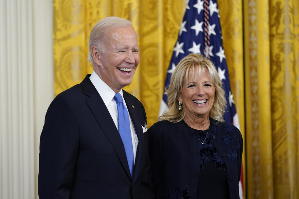 President Joe Biden and first lady Jill Biden laugh during a reception to celebrate the Jewish new year in the East Room of the White House in Washington, Friday, Sept. 30, 2022. (AP Photo/Susan Walsh)