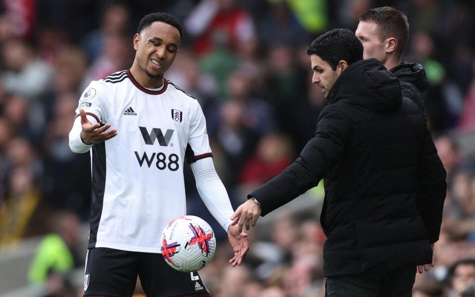 Fulham's Kenny Tete reacts with Arsenal manager Mikel Arteta - Reuters/David Klein