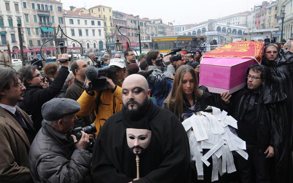 Venetians staged a mock funeral for the city 10 years ago, highlighting the decline in its population - EPA