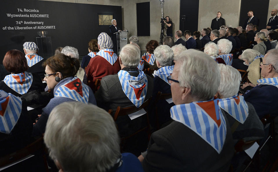 Survivors attend a commemoration event in the so-called "Sauna" building at the former Nazi German concentration and extermination camp Auschwitz II-Birkenau, on International Holocaust Remembrance Day in Oswiecim, Poland, Sunday, Jan. 27, 2019.(AP Photo/Czarek Sokolowski)