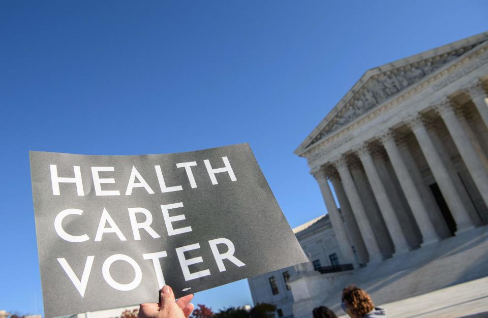 Demonstrator at the Supreme Court in Washington, D.C., on Nov. 10, 2020, as it opened arguments on the 2010 Affordable Care Act.