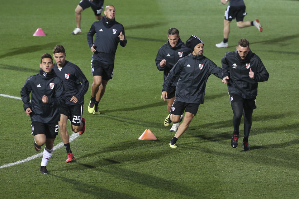 River Plate players run during a training session in Madrid, Spain, Thursday, Dec. 6, 2018. The Copa Libertadores Final will be played on Dec. 9 in Spain at Real Madrid's stadium for security reasons after River Plate fans last Saturday attacked the Boca Junior team bus heading into the Buenos Aires stadium for the meeting of Argentina's fiercest soccer rivals. (AP Photo/Andrea Comas)