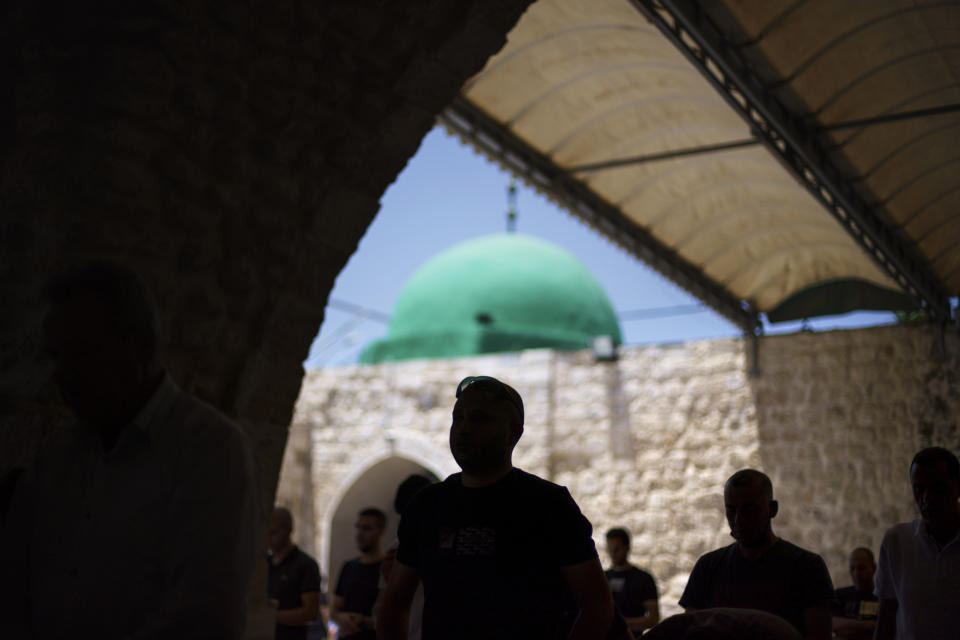 Muslims take part in Friday prayers at Al-Omari mosque in the mixed Arab-Jewish town of Lod, central Israel, Friday, May 28, 2021, a week after a cease-fire went into effect in the 11-day war between Gaza's Hamas rulers and Israel. (AP Photo/David Goldman)