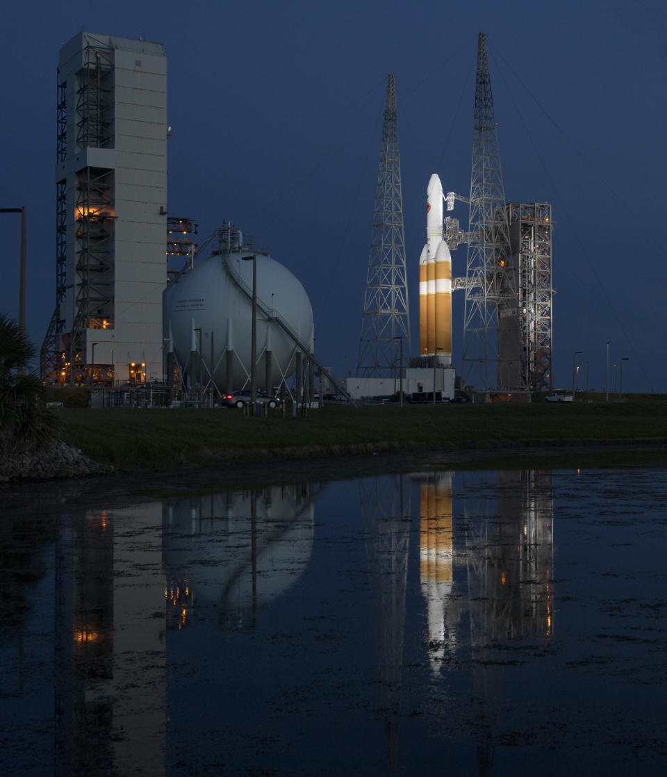 This photo provided by NASA shows the United Launch Alliance Delta IV Heavy rocket with the Parker Solar Probe onboard shortly after the Mobile Service Tower was rolled back, Friday, Aug. 10, 2018, at Launch Complex 37 at Cape Canaveral Air Force Station in Fla. NASA is sending the spacecraft straight into the sun's glittering crown, an atmospheric region so hot and harsh any normal visitor would wither. Set to launch early Saturday, the Parker Solar Probe is as heat-resistant as a spacecraft gets, essential for exploring our star closer than ever before. (Bill Ingalls/NASA via AP)