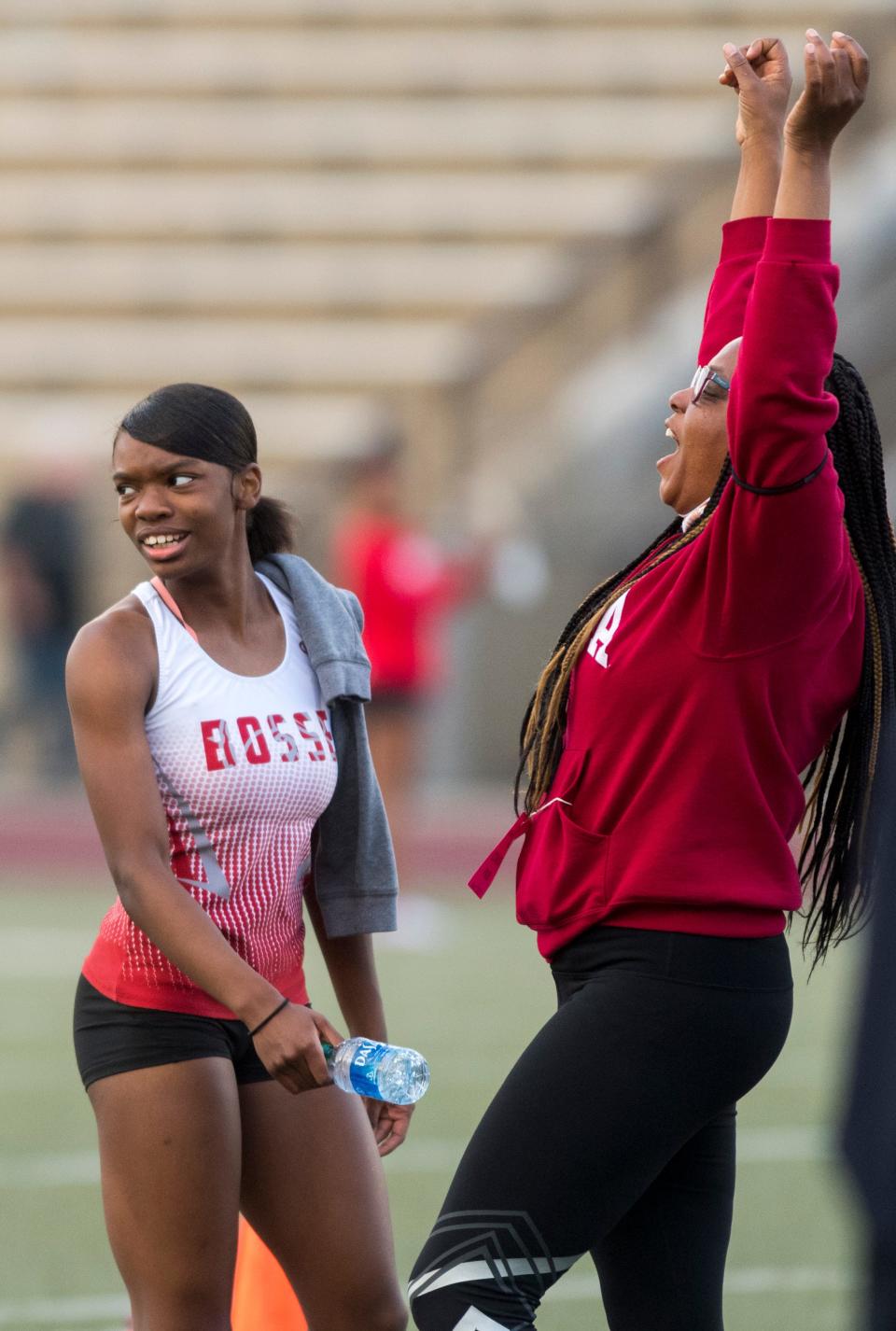 Bosse’s Alexia Smith is shocked as her coach Jennifer Martin celebrates Smith for breaking the 400 meter dash record during the SIAC Girls Track and Field meet at Central Stadium Friday evening, May 7, 2021.  Smith set a new record of 57.14 seconds. 
