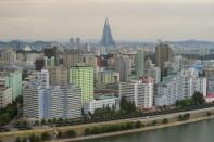 Military vehicles line up on a road in Pyongyang on October 10, 2015. North Korea is gearing up for a lavish celebration marking the 70th anniversary of its ruling Workers' Party