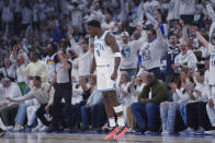 Minnesota Timberwolves guard Anthony Edwards (5) celebrates after making a 3-point shot during the first half of Game 2 of the team's NBA basketball first-round playoff series against the Phoenix Suns, Tuesday, April 23, 2024, in Minneapolis. (AP Photo/Abbie Parr)