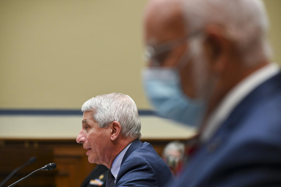 Dr. Anthony Fauci, director of the National Institute of Allergy and Infectious Diseases, speaks as Robert Redfield, director of the Centers for Disease Control and Prevention (CDC), right, listens during a House Select Subcommittee hearing on the Coronavirus, Friday, July 31, 2020 on Capitol Hill in Washington. (Erin Scott/Pool via AP)