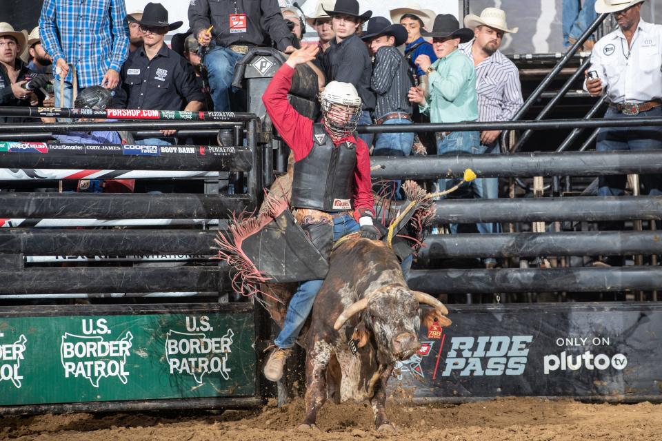 Mason Moody attempts to ride  Sour Diesel of Ultimate Bull Team during the Round 2 ( Short-Go ) of the PBR Pendleton Whisky Velocity Tour event in Wichita, KS.