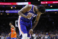 Philadelphia 76ers' Joel Embiid looks at his injured finger during the first half of an NBA basketball game against the Oklahoma City Thunder, Monday, Jan. 6, 2020, in Philadelphia.(AP Photo/Matt Slocum)