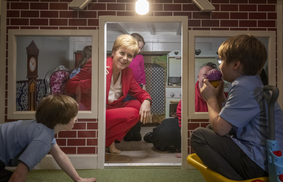 SNP leader Nicola Sturgeon plays with local children during a visit to the Jelly Tots & Cookies Play Cafe in Uddingston, South Lanarkshire.