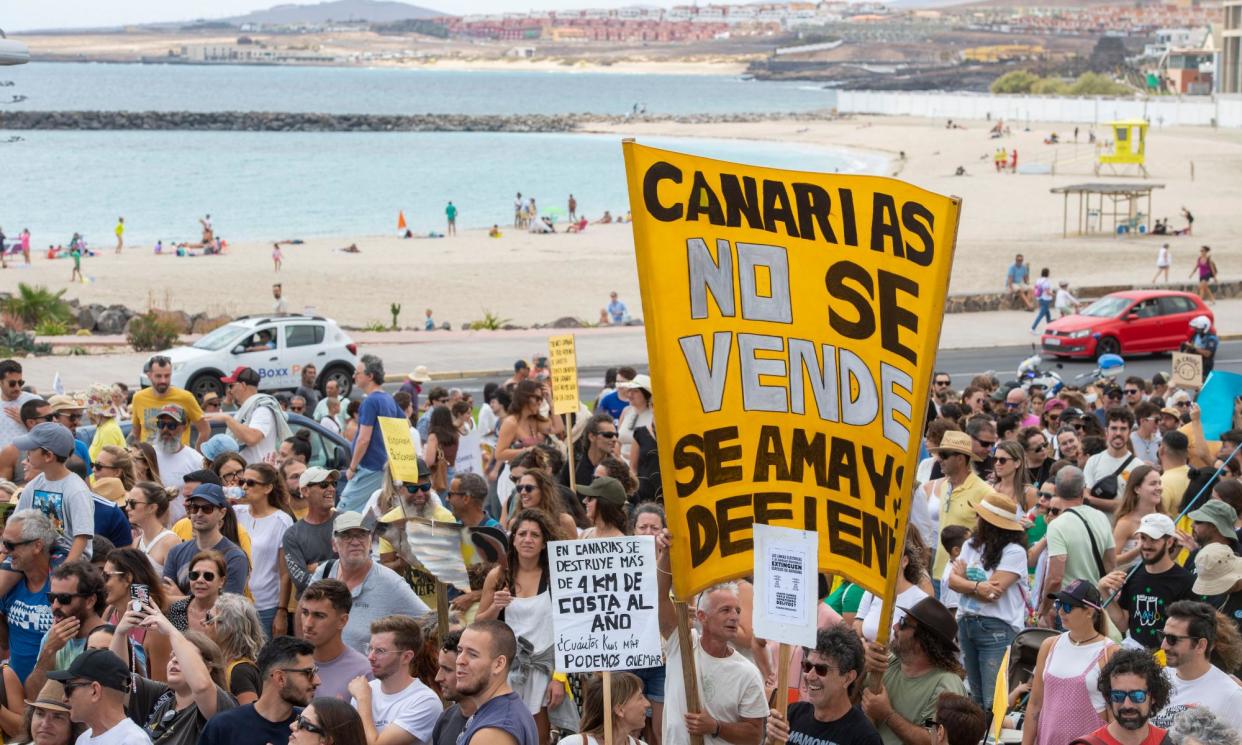 <span>People take part in a protest to demand an urgent rethink of the Canary Islands' tourism model, in Fuerteventura, Canary Islands, on Saturday.</span><span>Photograph: Carlos de Saá/EPA</span>