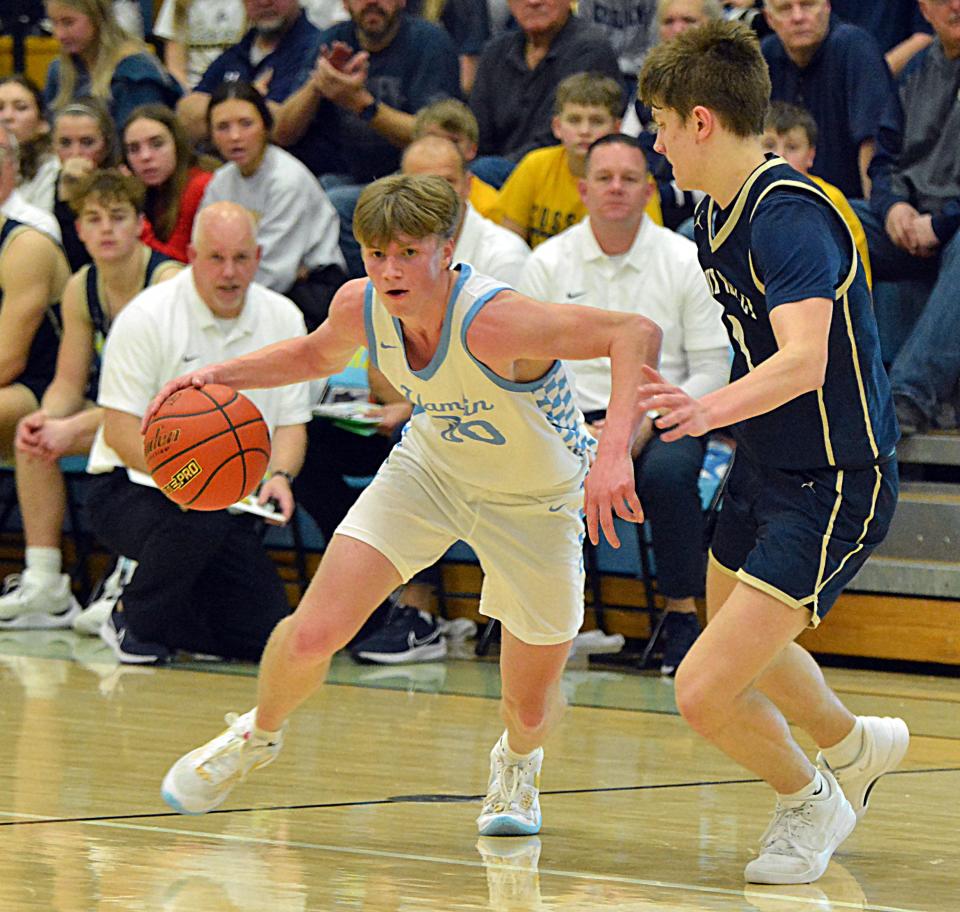 Hamlin's Tyson Stevenson dribbles past Sioux Valley's Maxwell Engebretson during their high school boys basketball game on Monday, Feb. 5, 2024 at the Hamlin Education Center. No. 2 Hamlin topped No. 4 Sioux Valley 80-48 in a battle of rated Class A teams.