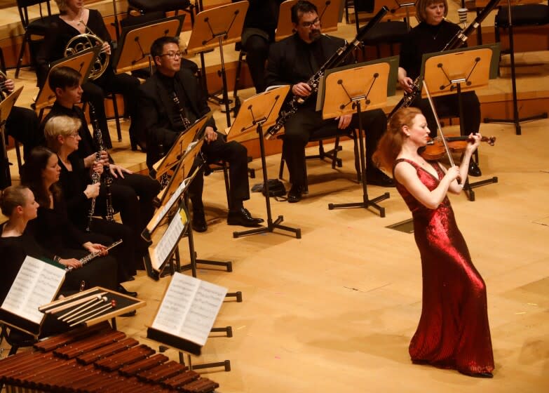 LOS ANGELES CA - FEBRUARY 7, 2020 - Violinist Carolin Widmann performs as Esa-Pekka Salonen, off camera, conducts the LA Phil in Weill's Violin Concerto as part of a program titled, "The Weimar Republic: Germany 1918-1933," at the Walt Disney Concert Hall on February 7, 2020. (Genaro Molina / Los Angeles Times)