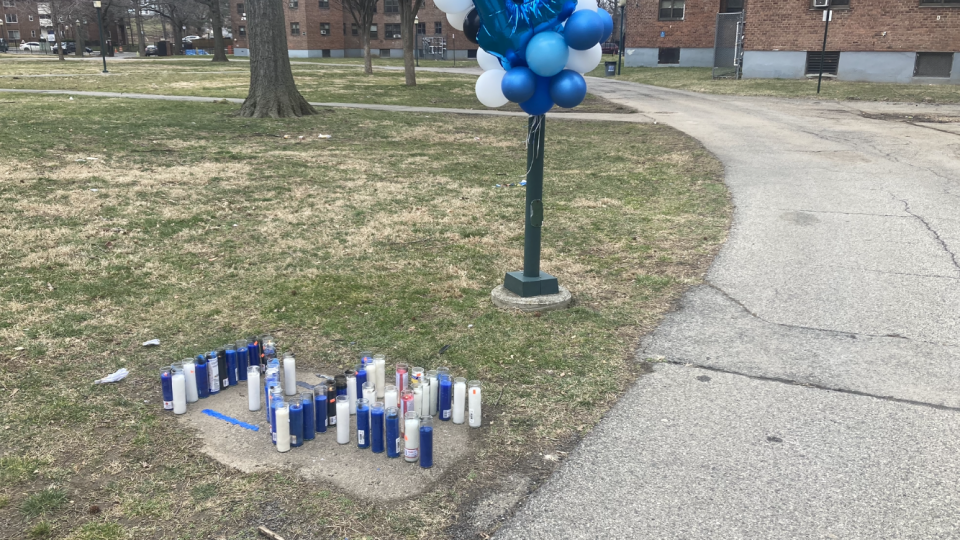 Balloons and candles mark the spot in the courtyard of Levister Towers where a 14-year-old Mount Vernon STEAM Academy 9th-grader was fatally shot on March 9, 2023. The candles are arranged in a Z for the boy's first name and the number 14.