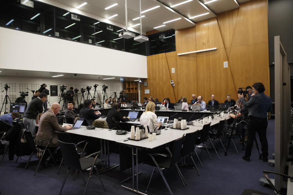 Reporters wait for the World Health Organization's Emergency Committee meeting on what scientists have identified as a new coronavirus, at the World Health Organization (WHO) headquarters in Geneva, Switzerland, Wednesday, Jan. 22, 2020. Health authorities are closely watching an outbreak of respiratory illness caused by a new virus from China. Governments are stepping up surveillance of airline passengers from central China and taking other steps to try to control the outbreak. (Salvatore Di Nolfi/Keystone via AP)