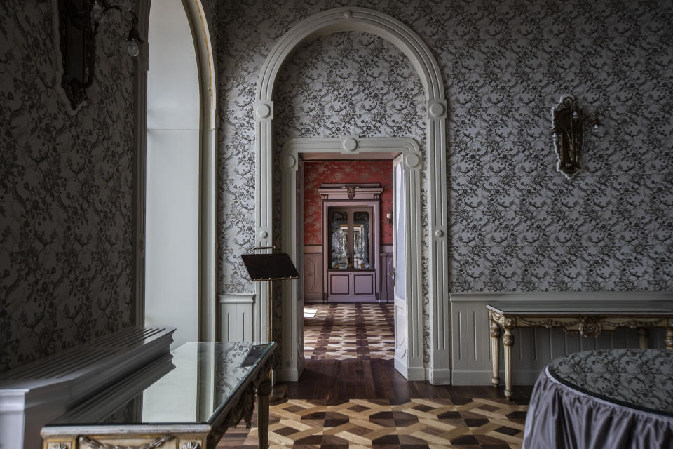 This picture taken on Thursday, May 14, 2020, shows an empty restaurant hallway of the historical Grand Hotel Tremezzo, in Tremezzo, on Como Lake, Italy. The hotel dates back to 1901. (AP Photo/Luca Bruno)