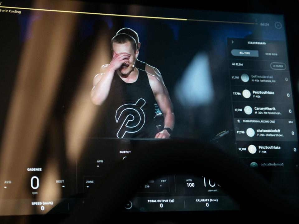 A Peloton instructor seen on the video display of a Peloton stationary bike