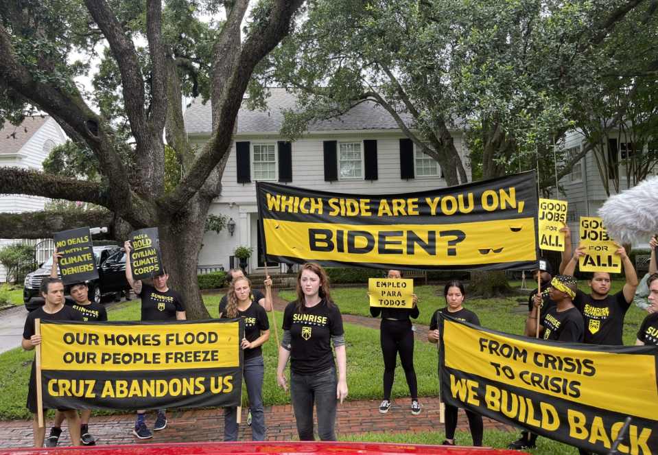 Protesters with the Sunrise Movement outside of the home of Texas Senator Ted Cruz on Monday before a number of them were arrested (Rachael Warriner)