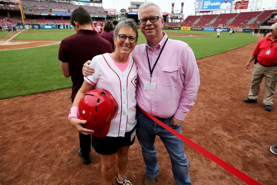 Laura and John Fay posed for a photo before the Cincinnati Reds played the Chicago Cubs. Laura was the Reds' honorary bat girl for the game. Laura died Jan. 4 after a long battle with cancer. John returned to spring training this week.