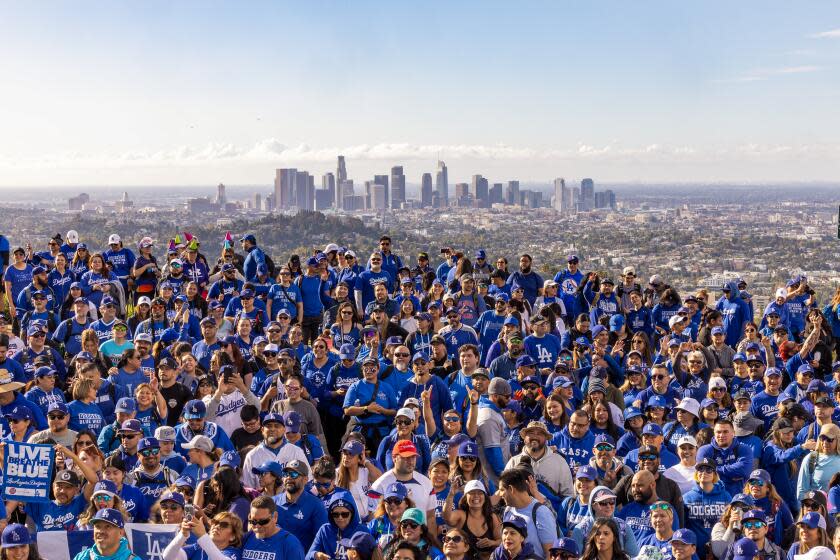 Hikers dressed in Dodger Blue gather for a group photo midway through an over six-mile hike through Griffith Park.
