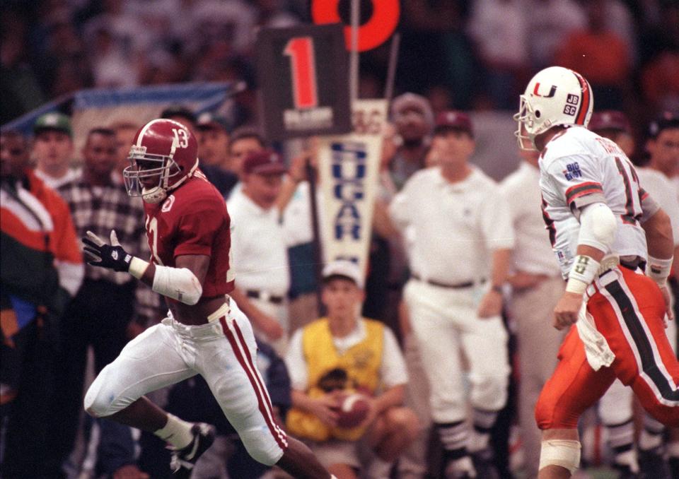 University of Alabama safety George Teague returns an interception for a touchdown on Jan. 1, 1993, in the Sugar Bowl in New Orleans.