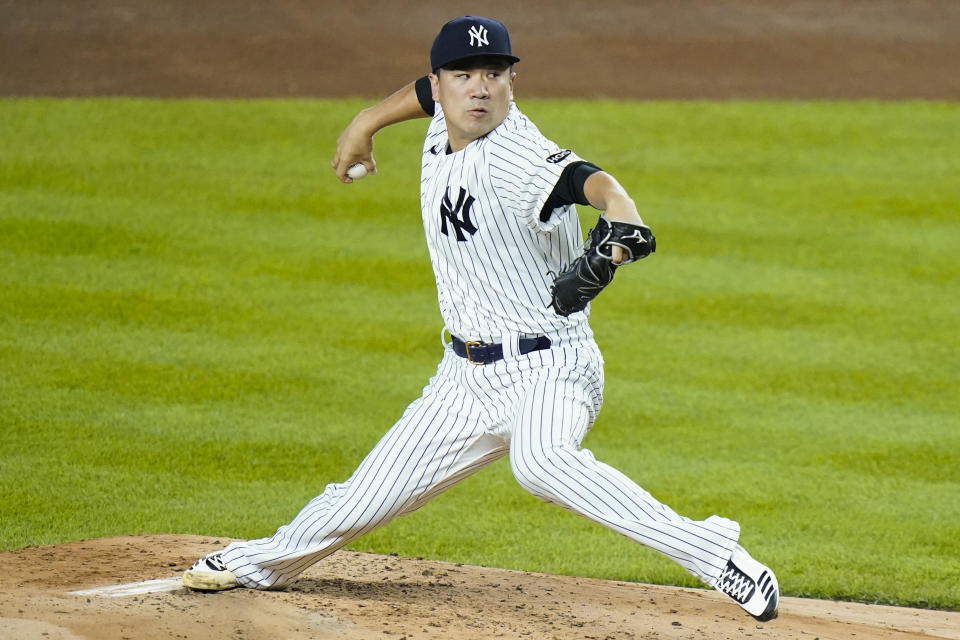 FILE - New York Yankees' Masahiro Tanaka, of Japan, delivers a pitch during the second inning of the team's baseball game against the Toronto Blue Jays in New York, in this Thursday, Sept. 17, 2020, file photo. Former New York Yankees pitcher Masahiro Tanaka has signed a two-year contract with the Rakuten Eagles in Japanese baseball, the club said Thursday, Jan. 28, 2021. (AP Photo/Frank Franklin II, File)