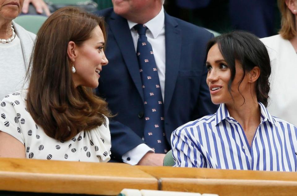 Kate Middleton, Duchess of Cambridge and Meghan Markle, Duchess of Sussex attend Wimbledon.