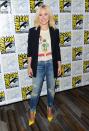<p>Kristen went for a more casual look for ‘The Good Place’ press line sporting ripped jeans and a Mickey Mouse tee. [<i>Photo: REX]</i></p>