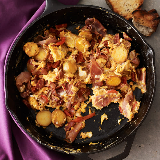 <p>For this dish, chef Neal Fraser uses spicy chorizo and Spanish <em>lomo</em> (cured pork loin) in scrambled eggs, along with potatoes, piquillo peppers and smoky paprika. Since <em>lomo</em> can be hard to find, we’ve substituted readily available serrano ham.</p>