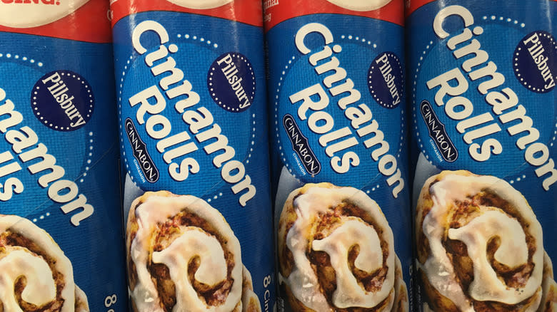 Close-up of four cans of Pillsbury cinnamon rolls