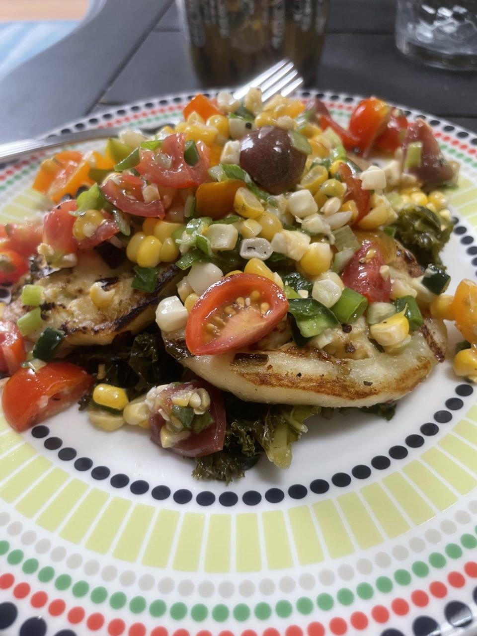 Full of local flavors this dish stars grilled eggplant topped with southern twist on chimichurri feating sweet corn and tomatoes.