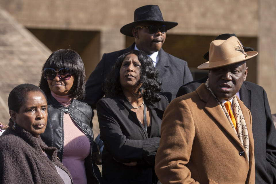 RowVaughn Wells, center, the mother of Nichols stands during a press conference after an indictment hearing for five former Memphis police officers charged in the death of her son at the Shelby County Criminal Justice Center Friday, Feb. 17, 2023, in Memphis, Tenn. (AP Photo/Brandon Dill)