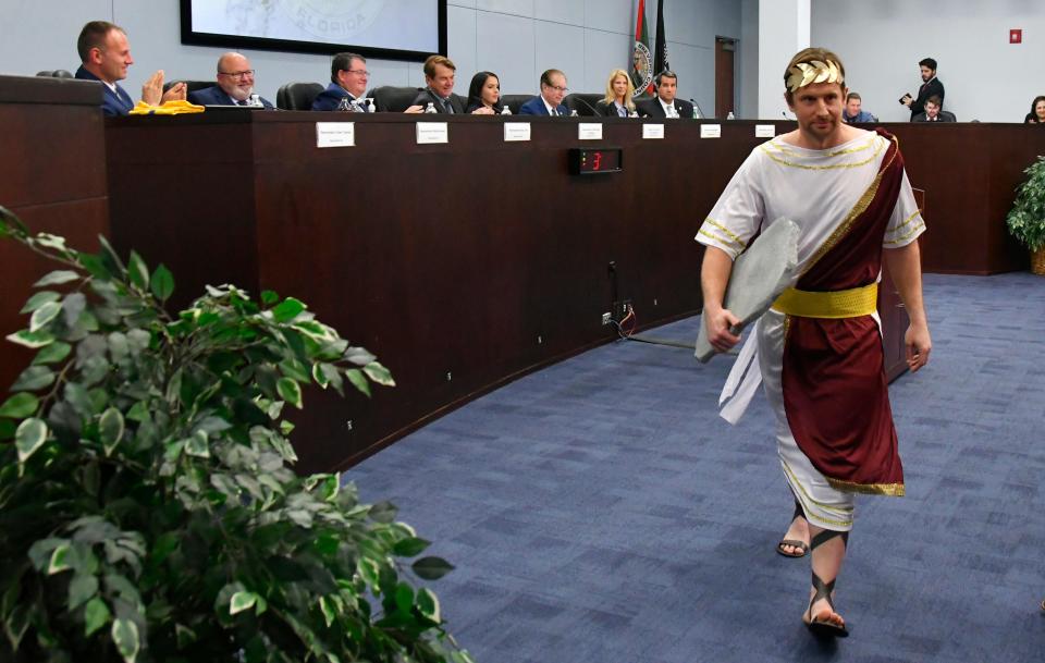 Brevard County Commissioner John Tobia, dressed in Roman costume, brings some humor to a meeting of the Brevard Legislative Delegation in January 2023. Behind him on the panel are the county's Florida House and Senate representatives.