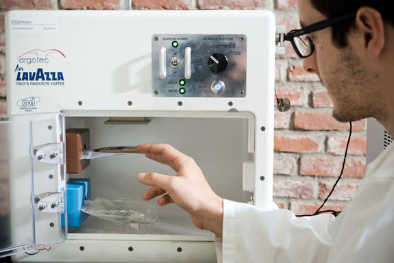 The "ISSPresso" machine, which is scheduled to arrive at the International Space Station in April 2015 to make high-quality coffee for astronauts. Water enters the machine through the bottom bag, and coffee is pumped into the upper bag.