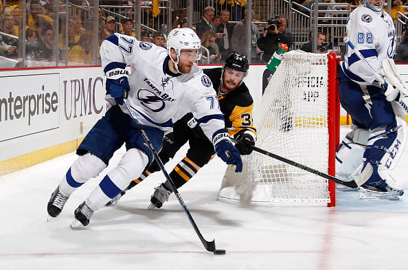 PITTSBURGH, PA - MAY 26: Victor Hedman #77 of the Tampa Bay Lightning moves the puck in front of Tom Kuhnhackl #34 of the Pittsburgh Penguins in Game Seven of the Eastern Conference Final during the 2016 NHL Stanley Cup Playoffs at Consol Energy Center on May 26, 2016 in Pittsburgh, Pennsylvania. (Photo by Gregory Shamus/NHLI via Getty Images) *** Local Caption ***