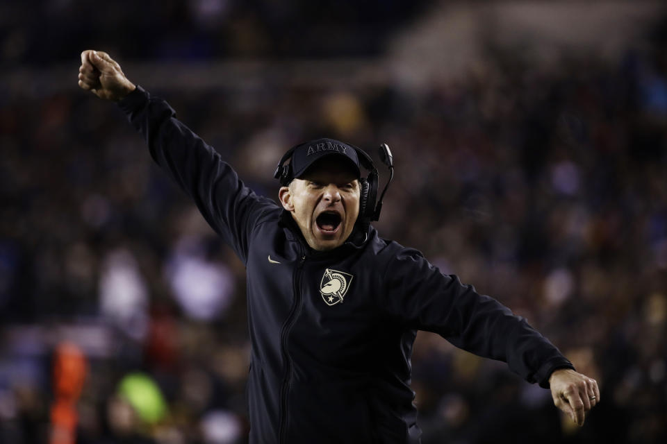 Army head coach Jeff Monken cheers during the second half an NCAA college football game against the Navy, Saturday, Dec. 8, 2018, in Philadelphia. Army won 17 -10. (AP Photo/Matt Rourke)