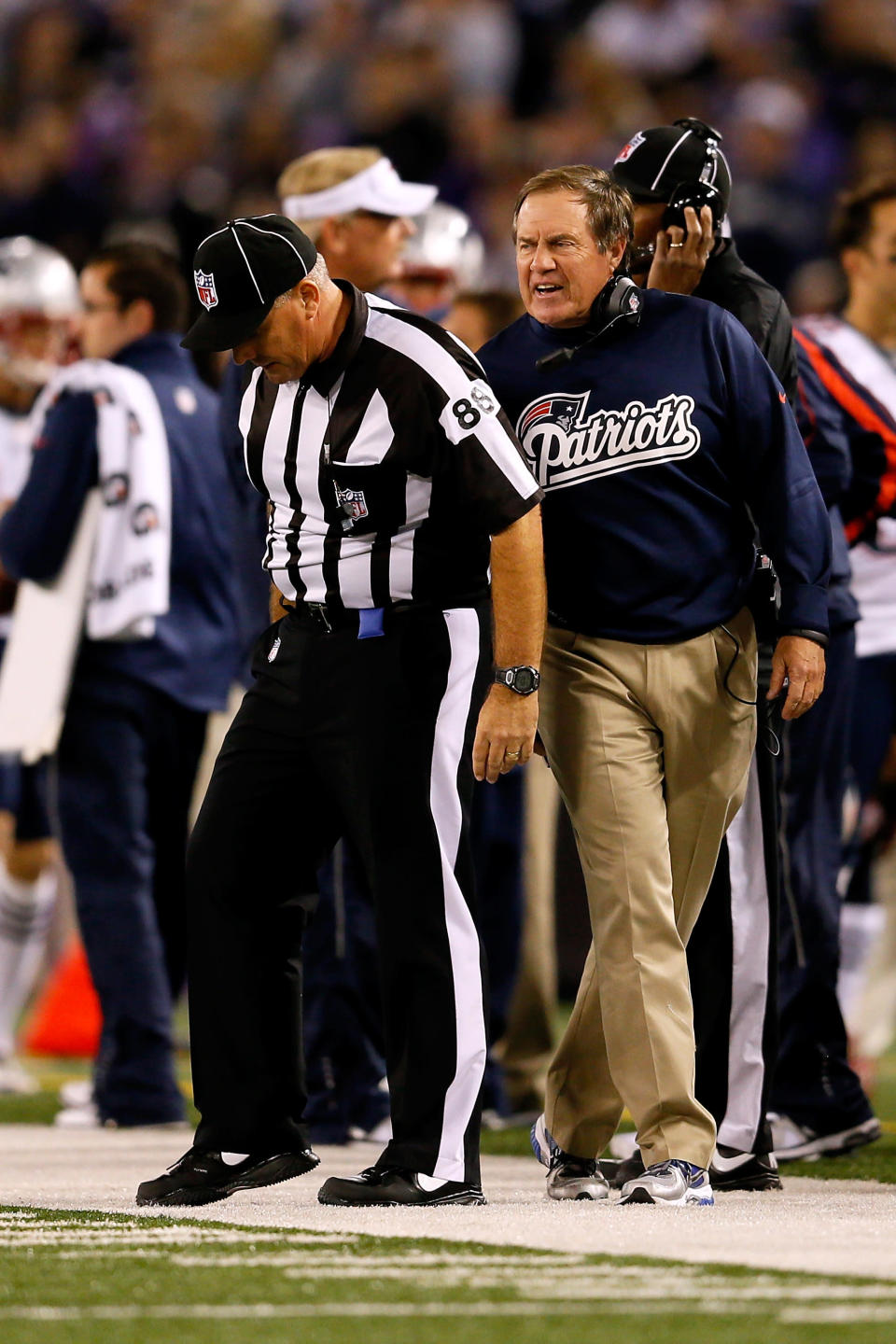 BALTIMORE, MD - SEPTEMBER 23: Head coach Bill Belichick of the New England Patriots yells at an official following an offensive interference penalty against the Patriots in the first quarter against the Baltimore Ravens at M&T Bank Stadium on September 23, 2012 in Baltimore, Maryland. (Photo by Rob Carr/Getty Images)