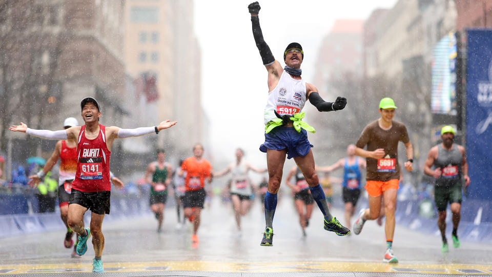  BOSTON, MASSACHUSETTS - APRIL 17: Fernando Ferreira celebrates in the rain as he crosses the finish line during the 127th Boston Marathon on April 17, 2023 in Boston, Massachusetts. (Photo by Maddie Meyer/Getty Images). 