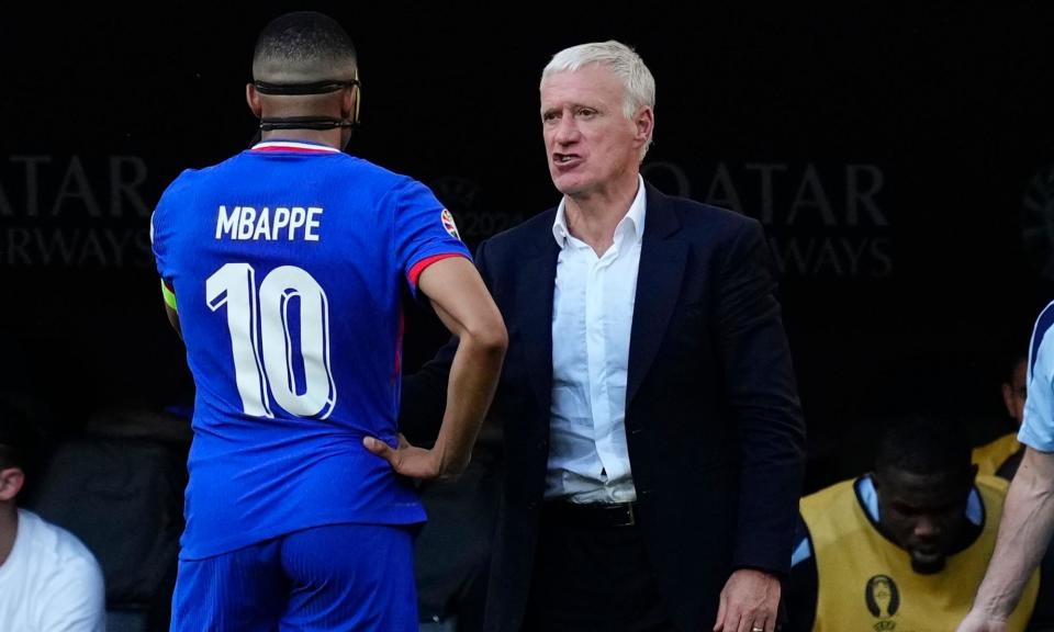 <span>Didier Deschamps giving instructions to the returning <a class="link " href="https://sports.yahoo.com/soccer/players/3893765/" data-i13n="sec:content-canvas;subsec:anchor_text;elm:context_link" data-ylk="slk:Kylian Mbappé;sec:content-canvas;subsec:anchor_text;elm:context_link;itc:0">Kylian Mbappé</a> during <a class="link " href="https://sports.yahoo.com/soccer/teams/france/" data-i13n="sec:content-canvas;subsec:anchor_text;elm:context_link" data-ylk="slk:France;sec:content-canvas;subsec:anchor_text;elm:context_link;itc:0">France</a>’s draw with Poland.</span><span>Photograph: Jose Breton/NurPhoto/Shutterstock</span>