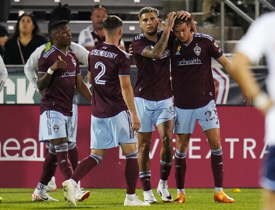 Colorado Rapids forward Rafael Navarro (9) congratulates midfielder Cole Bassett (23) after Bassett's goal against the Vancouver Whitecaps during the second half of an MLS soccer match Wednesday, Sept. 27, 2023, in Commerce City, Colo. (AP Photo/Jack Dempsey)