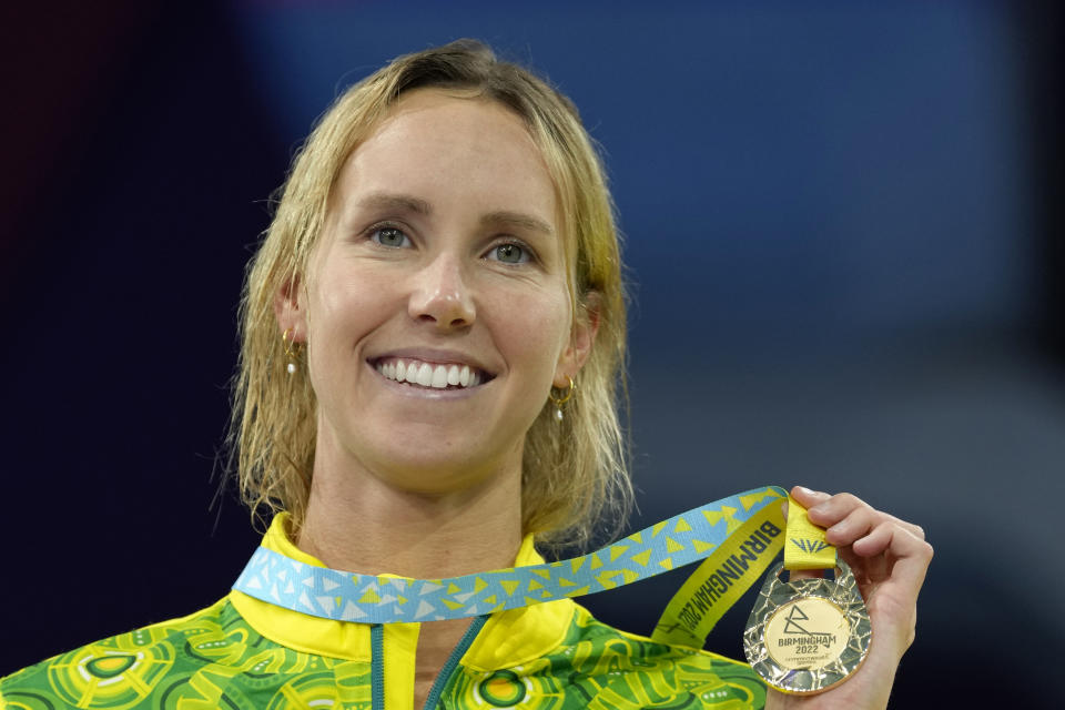 Emma McKeon of Australia poses after winning the gold medal in the Women's 50 meters butterfly final during the swimming competition of the Commonwealth Games, at the Sandwell Aquatics Centre in Birmingham, England, Monday, Aug. 1, 2022. (AP Photo/Kirsty Wigglesworth)