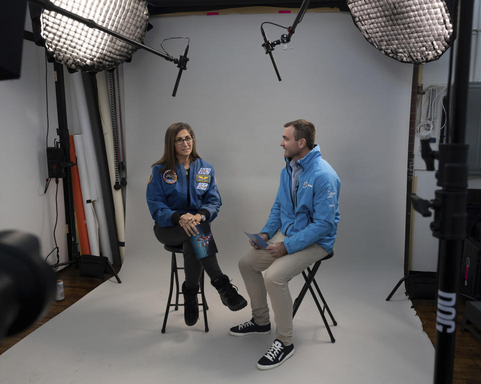 This photo provided by 11th Hour Racing shows former astronaut Nicole Stott and 11th Hour Racing co-founder and skipper Charlie Enright discussing their unique perspectives on ocean health in Providence, R.I., Dec. 19, 2022. Enright is about to lead 11th Hour Racing in the round-the-world Ocean Race, which begins Sunday from Alicante, Spain. (Rane Brower/11th Hour Racing via AP)