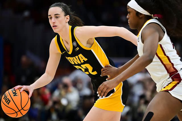 <p>Ben Solomon/NCAA Photos via Getty</p> Caitlin Clark playing for the Iowa Hawkeyes in April 2024